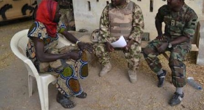 Disguised-_terrorist_suspects_being_interrogated_by_troops
