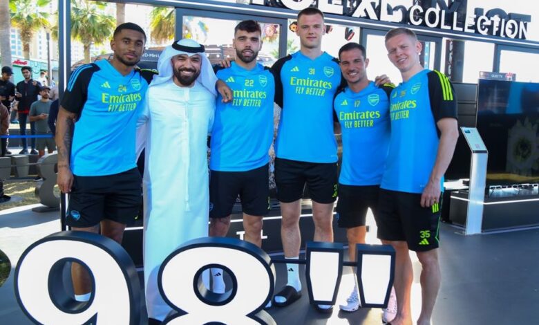 Arsenal players, Reiss Nelson, David Raya Martín, Karl Jakob Hein, Cédric Soares, and Oleksandr Zinchenko (from L to R), with Khalid Al Ameri (2nd from L) at the TCL Experience Zone